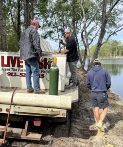 workers on a fish truck for fish delivery